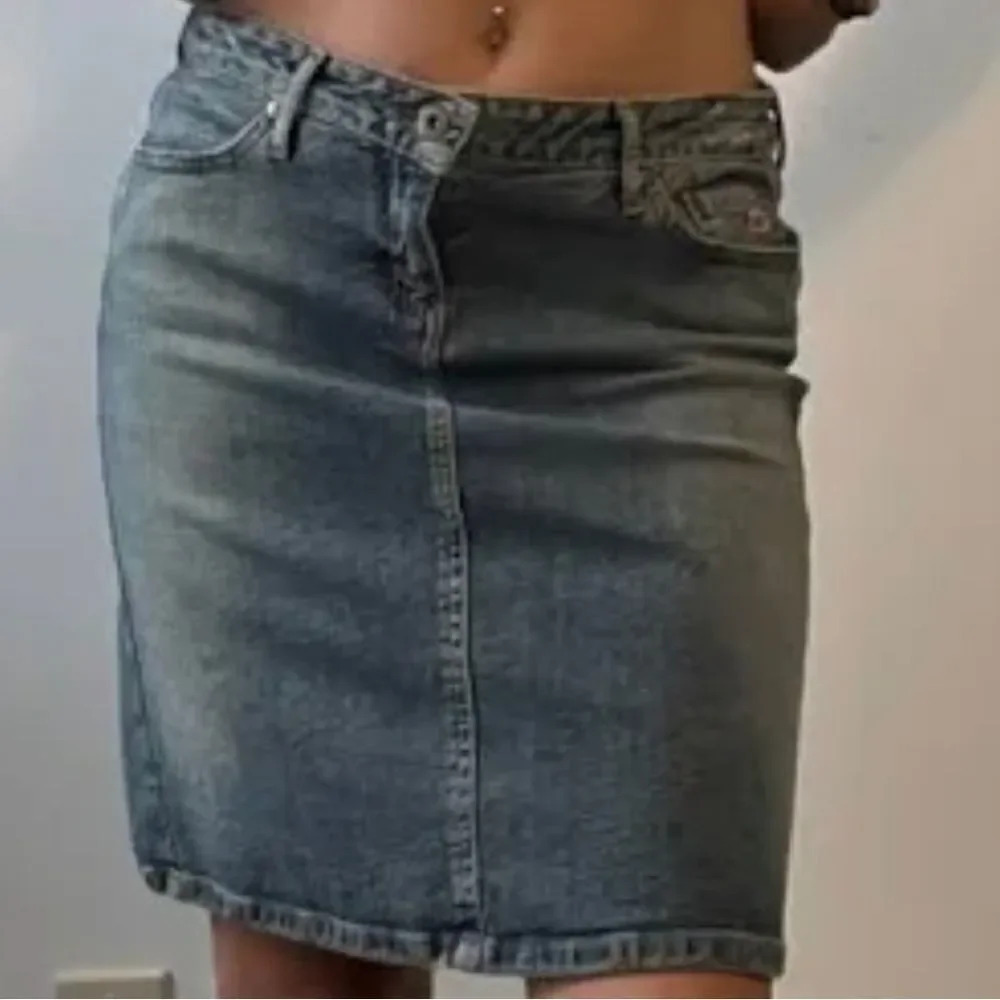 Paris Blues jean skirt with back slit.  Size 11
